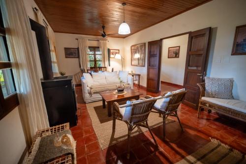 a living room with a couch and a table at Estancia Iberá in Colonia Carlos Pellegrini