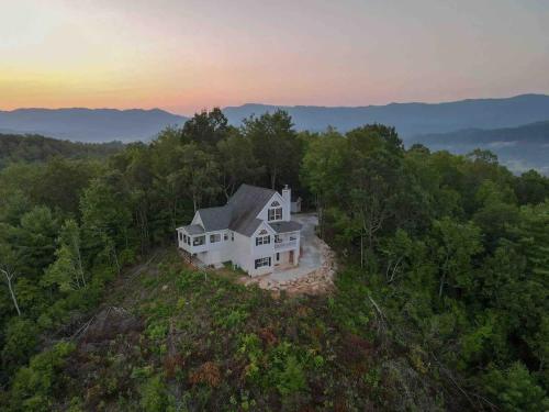 an aerial view of a white house in the woods at Sky Harbour in Andrews