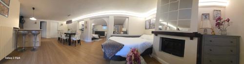 a bedroom with a bed and a tv in it at appartamento comfort Malpensa check in h 24 posto auto privato in Casorate Sempione