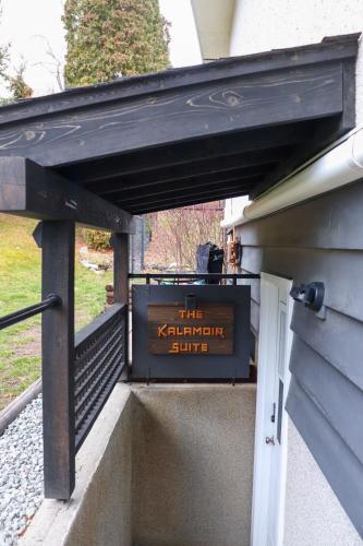 a sign on the side of a building at The Kalamoir Suite in West Kelowna
