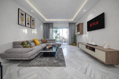 a living room with a couch and a table at La Siesta Beach Resort in Mohammedia