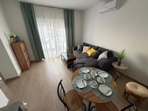 a living room with a table and a couch at Sunset Bay Casa in Dolac