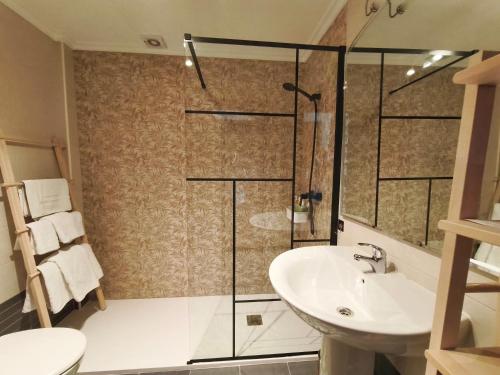 a bathroom with a shower and a sink at APARTAMENTO VALMAYOR in Potes