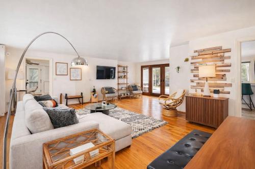 a living room with a couch and a table at Private Riverside Retreat in Appleton
