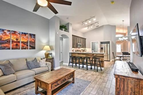 a living room with a couch and a table at Luxury Retreat with 2 Master Suites Pool & Hot Tub BBQ Pool Table 2 Miles Disney in Orlando