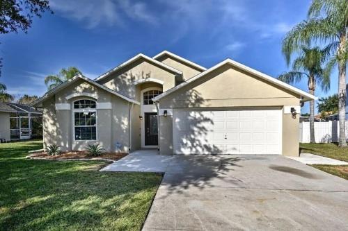 a house with a garage and palm trees at Luxury Retreat with 2 Master Suites Pool & Hot Tub BBQ Pool Table 2 Miles Disney in Orlando