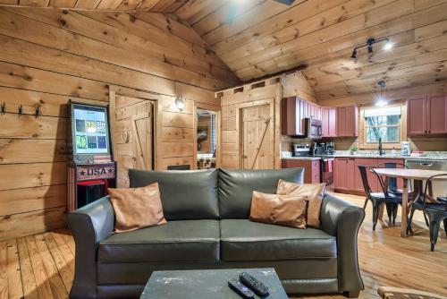 a living room with a couch and a table at Dog friendly, Hot Tub & Near Tuckaleechee Caverns in Townsend