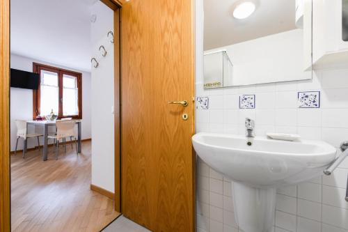 a bathroom with a sink and a mirror at Anna Home View in Sirmione
