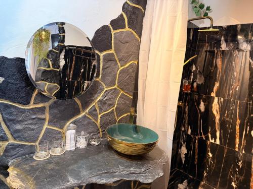 a bathroom with a sink and a mirror at Apartmán Mair Pardubice in Pardubice