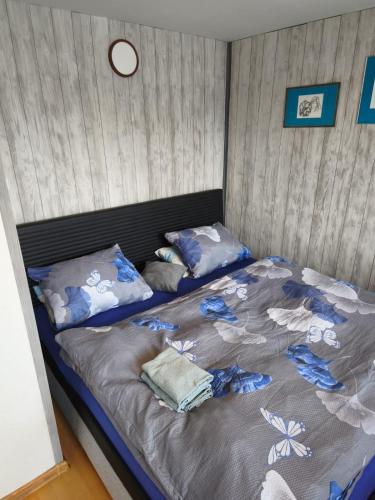 a bed with two pillows on it in a bedroom at U Pepana in Velké Svatoňovice