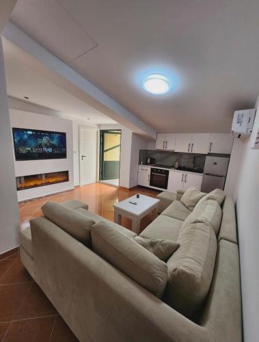 a large living room with a couch and a table at Apartment 4 by Villa Ceni in Elbasan