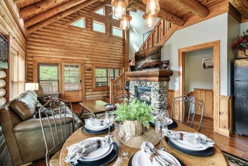 a living room with a table and a fireplace at 2mils Dollywood, Resort Pool, King Bed, SL6 in Pigeon Forge