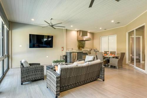 a living room with couches and a television on a wall at The Riverview Estates in Riverview