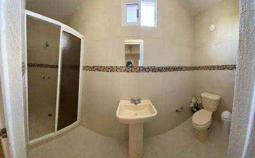 a bathroom with a sink and a toilet and a shower at Hotel Mexico in Cancún