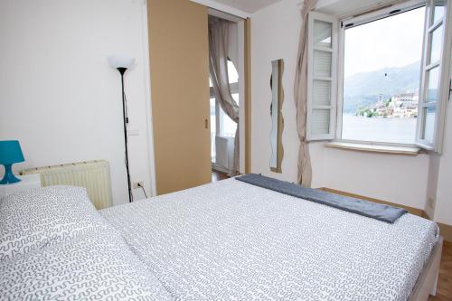 Ένα ή περισσότερα κρεβάτια σε δωμάτιο στο -Ortaflats- Appartamento Gli Archi