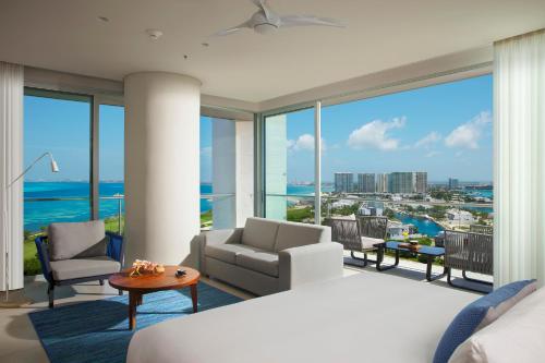 a bedroom with a bed and a view of the ocean at Dreams Vista Cancun Golf & Spa Resort - All Inclusive in Cancún