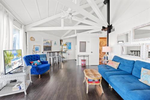a living room with a blue couch and chairs at 8951 - Ozzie's Island Hideaway in Hatteras