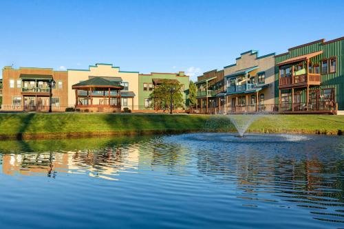 a building with a fountain in the middle of a lake at WorldMark Bison Ranch in Overgaard