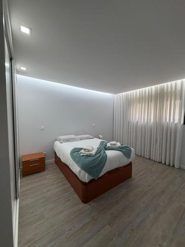 a bedroom with a bed in a room at Dream House in Aldeia Nova