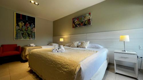 a bedroom with a bed with two stuffed animals on it at LS Hotel in Salta