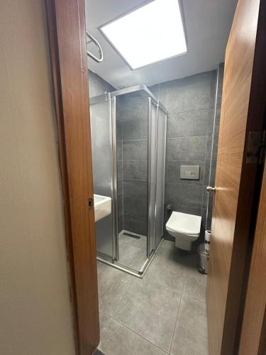 a bathroom with a shower and a toilet at Ramona Lara in Antalya
