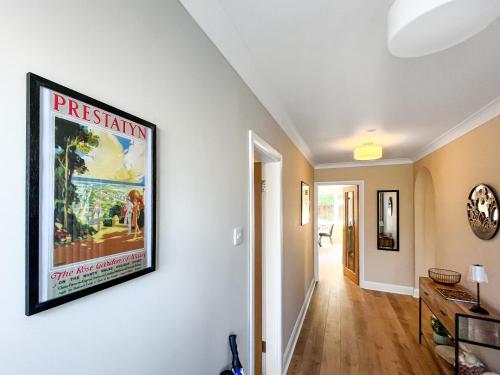 a living room with a large painting on the wall at Casa Rosa in Prestatyn