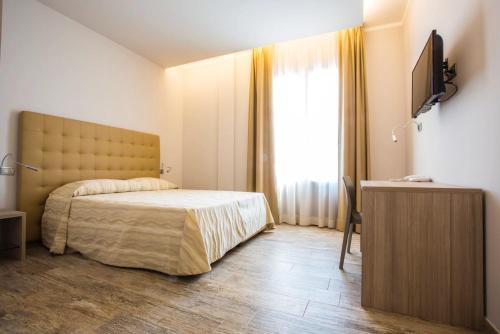 Postel nebo postele na pokoji v ubytování Il Feudo Di Agnadello