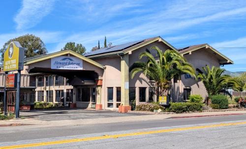 a hotel on the corner of a street at Olive Tree Inn & Suites, a Howard Johnson by Wyndham in San Luis Obispo