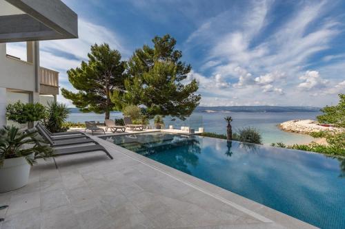 Seaside apartments with a swimming pool Medici, Omis - 25214
