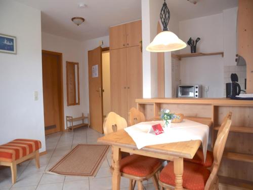 a kitchen and dining room with a table and chairs at Beautiful lodging in the Alps near Bayrischzell in Bayrischzell
