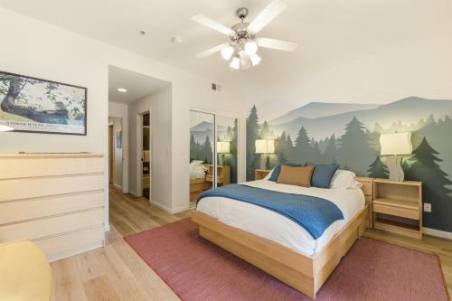 a bedroom with a bed with a painting on the wall at 2 Miles to Palisades Ski Resort w Free Shuttle! in Olympic Valley