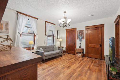 a living room with a couch and a chair at Spacious 2BR Across from Como Lake - Bramble in Saint Paul
