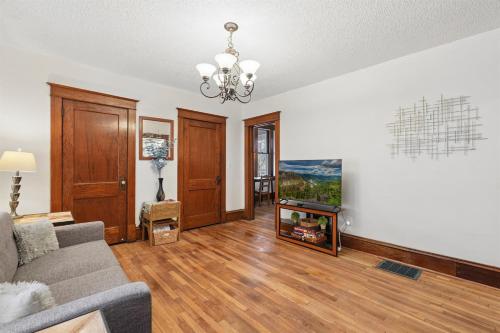 a living room with a couch and a fireplace at Spacious 2BR Across from Como Lake - Bramble in Saint Paul