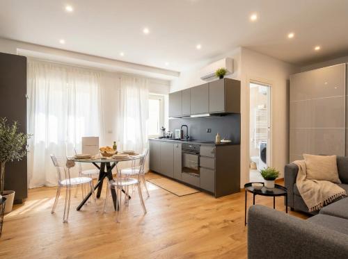 a kitchen and living room with a table and chairs at Sparano Mood 170 in Bari