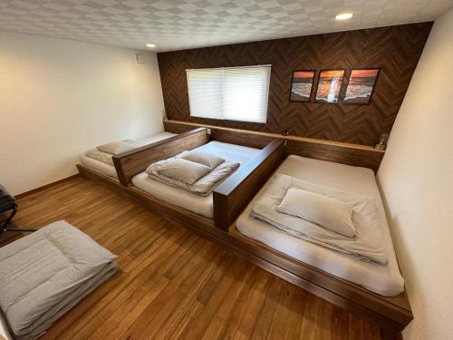 a room with two bunk beds in a room at SunSet Villa - Vacation STAY 27888v in Nagaoka