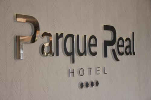 a sign for a hotel with the words fireridge real hotel at Hotel Parque Real in Ciudad Real