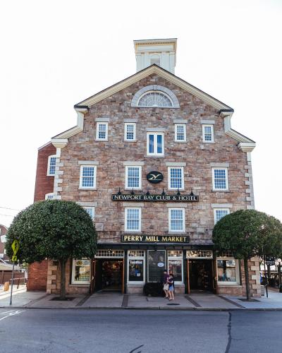 a large brick building with a sign on it at Newport Bay Club and Hotel in Newport