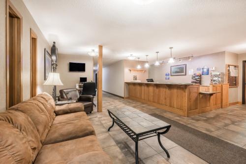 a living room with a couch and a pharmacy at Days Inn by Wyndham Spearfish in Spearfish