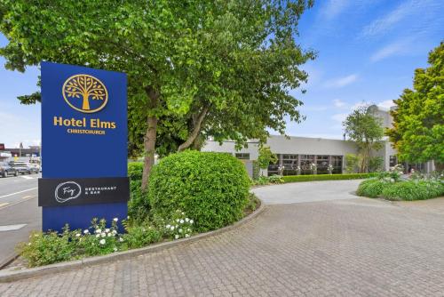 a sign in front of a building at Hotel Elms Christchurch, an Ascend Collection Hotel in Christchurch
