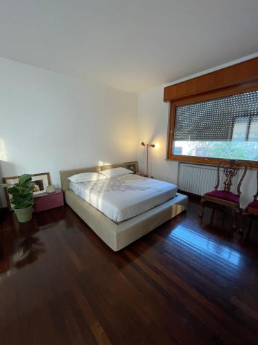 a bedroom with a bed and a window in it at MONTECAMPI casa di charme in Meda