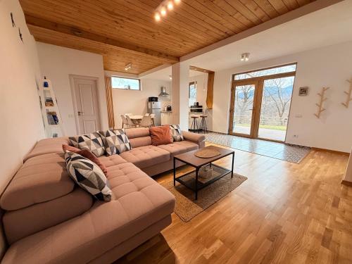 a living room with a couch and a table at Casa Aluna Duo in Bran
