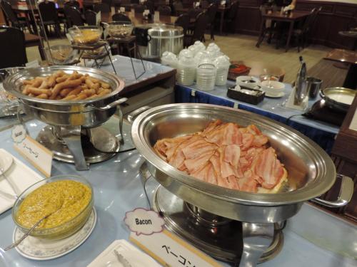 a buffet with meat and other food on a table at Hotel Grand Terrace Sendai Kokubun-cho in Sendai