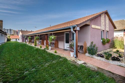 a house with a lawn in front of it at Apartmán Bonita in Štúrovo