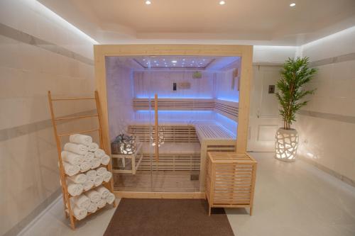 a room with a sauna with a plant in it at Rhodos Horizon Marina - Adults Only in Rhodes Town