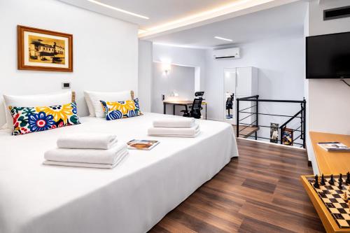 a room with a bed with a chess board on it at Enervillas VIP Villas with pool bbq in Káto Alissós