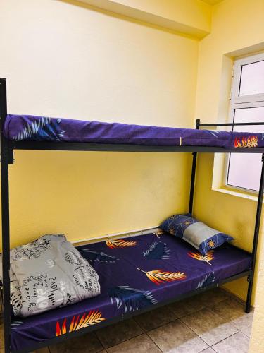 Llit o llits en una habitació de Wishwell hostel