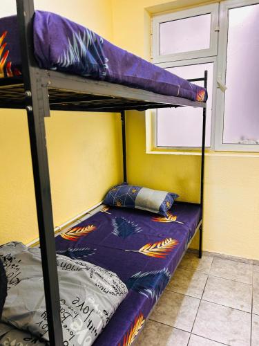 Llit o llits en una habitació de Wishwell hostel