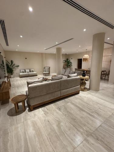 a large living room with a couch and a table at Umm Al Quwain Beach Hotel in Umm Al Quwain