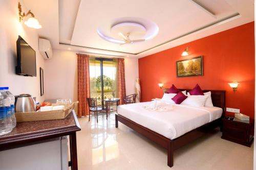 Ένα ή περισσότερα κρεβάτια σε δωμάτιο στο Praia Da Oura - Boutique Resort