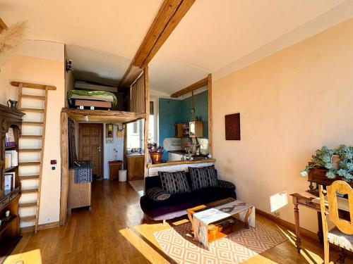 a living room with a couch and a table at amazing view appartment in Lyon